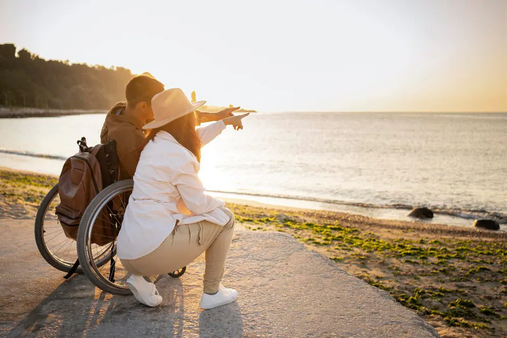 Two people enjoying a seaside outing together, illustrating community access support in brisbane.