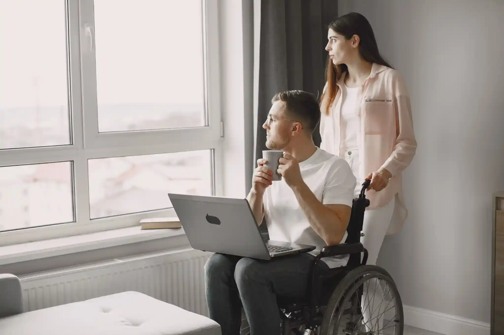 Two people looking at a laptop together