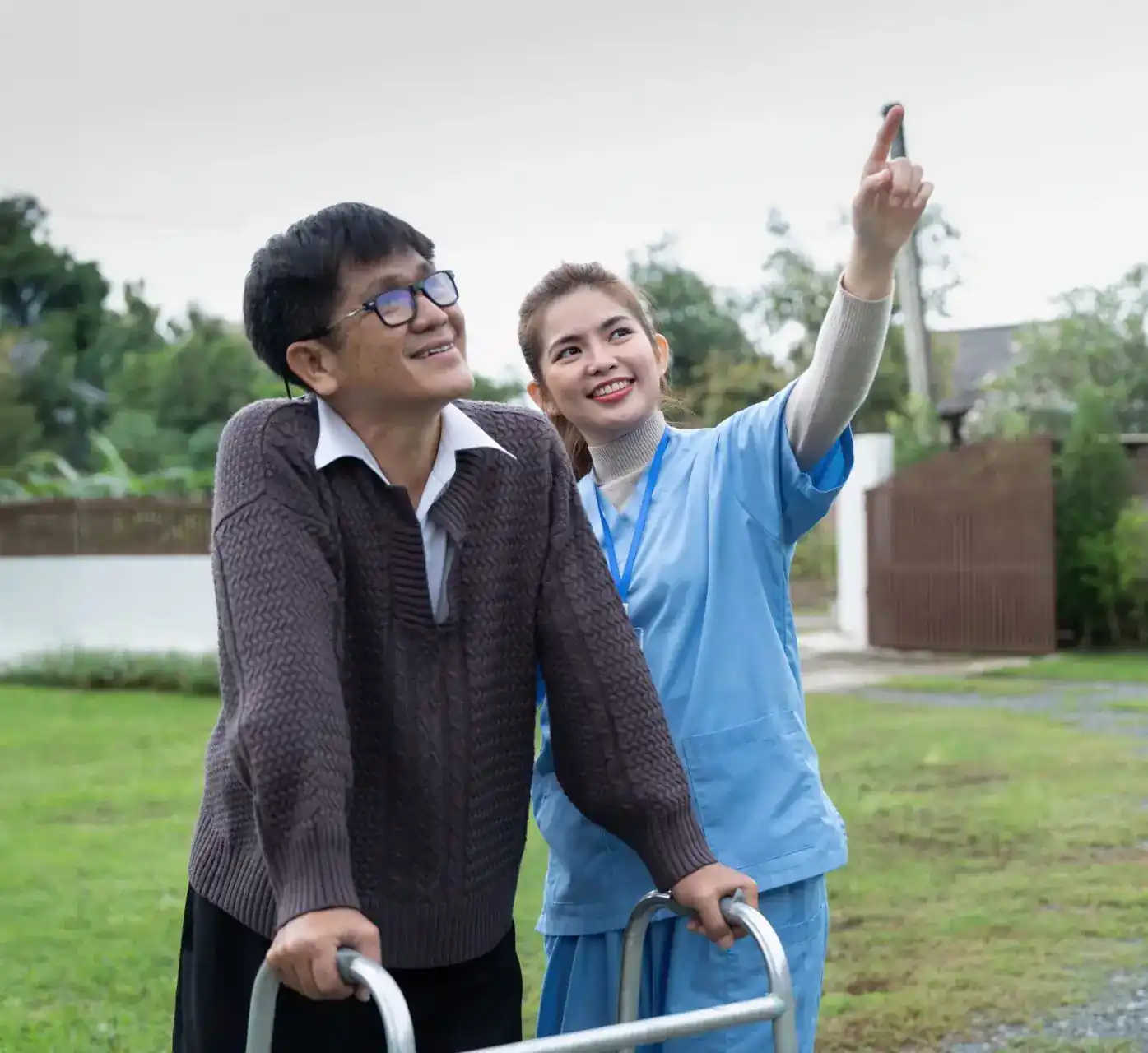 Two people looking towards the sky outdoors, illustrating ndis support services in gympie.