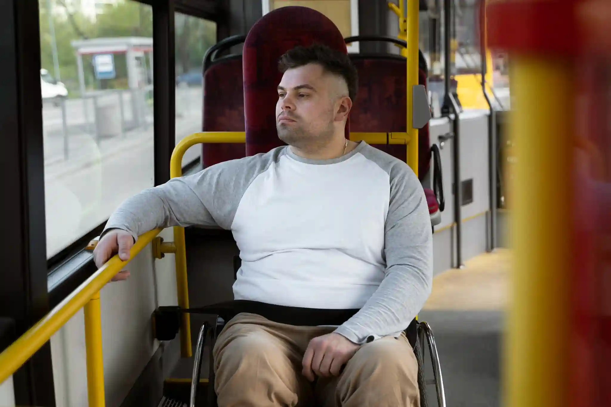 A person using a wheelchair travelling on public transport